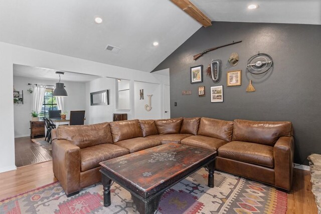 1604 Robb Ln, Round Rock, TX 78664 - living room featuring wood finished floors, baseboards, vaulted ceiling with beams, and visible vents