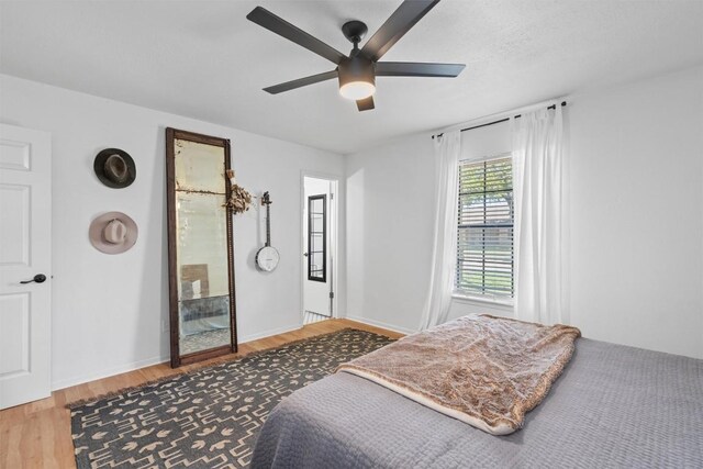 1604 Robb Ln, Round Rock, TX 78664 - bedroom with baseboards, a ceiling fan, and wood finished floors