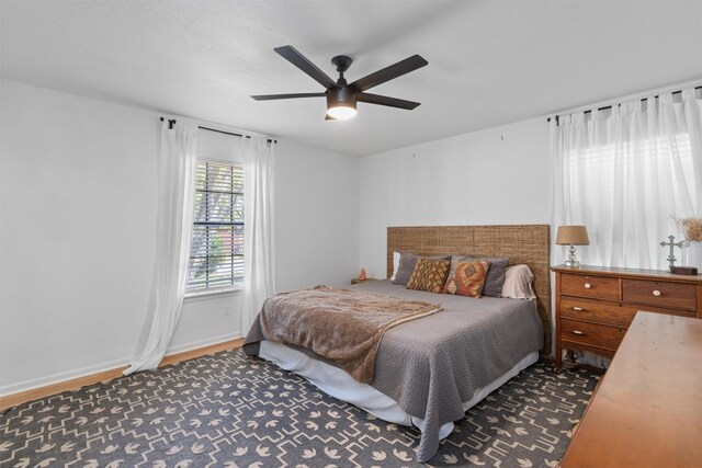 1604 Robb Ln, Round Rock, TX 78664 - bedroom with baseboards, ceiling fan, and wood finished floors