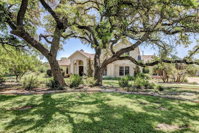 200 Matzig Cv, Buda, TX 78610 - view of front of property featuring a front yard and stucco siding