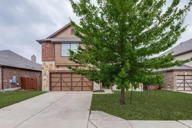 339 Alamosa Dr, Georgetown, TX 78626 - view of front of home featuring stone siding, concrete driveway, and an attached garage