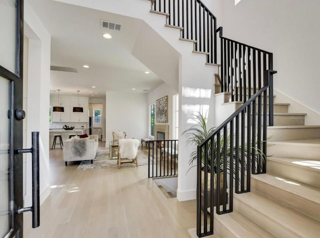 2000 Raleigh Ave, Austin, TX 78703 - entryway with light wood-style flooring, recessed lighting, and stairway