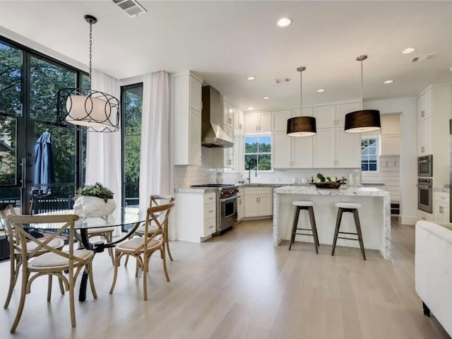 2000 Raleigh Ave, Austin, TX 78703 - dining room with light wood-type flooring and recessed lighting