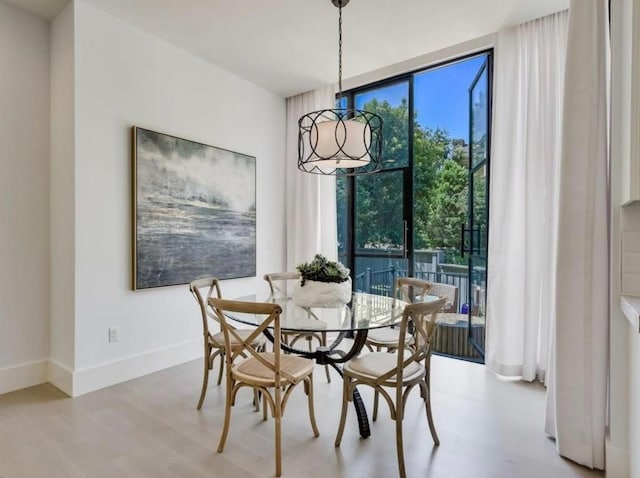 2000 Raleigh Ave, Austin, TX 78703 - dining area with wood finished floors and expansive windows
