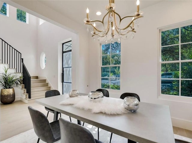 2000 Raleigh Ave, Austin, TX 78703 - dining area featuring stairs, a chandelier, and plenty of natural light