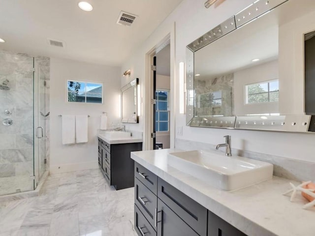 2000 Raleigh Ave, Austin, TX 78703 - bathroom with a shower stall, two vanities, recessed lighting, and marble finish floors