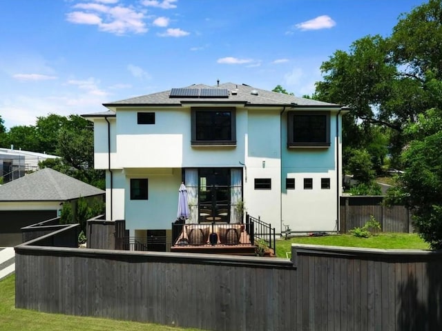 2000 Raleigh Ave, Austin, TX 78703 - rear view of property with stucco siding and solar panels