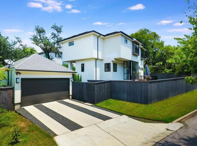 2000 Raleigh Ave, Austin, TX 78703 - view of front of home featuring stucco siding, driveway, and an attached garage