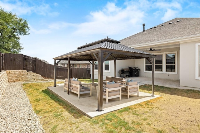 124 Adina Dr, Dripping Springs, TX 78620 - fenced backyard featuring a gazebo, outdoor lounge area, a patio, and a ceiling fan