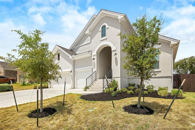 124 Adina Dr, Dripping Springs, TX 78620 - view of front facade featuring stucco siding and driveway