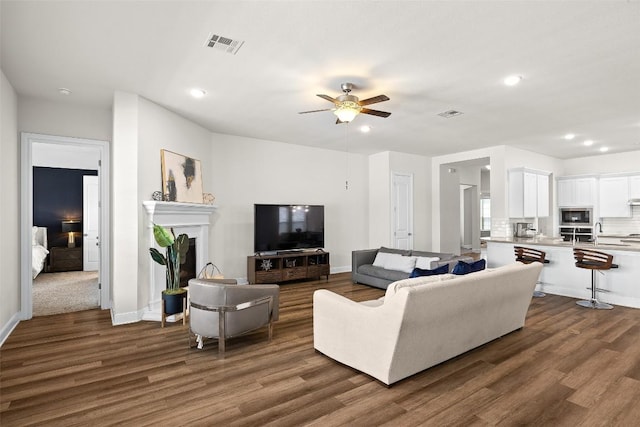 124 Adina Dr, Dripping Springs, TX 78620 - living room featuring dark wood finished floors, recessed lighting, ceiling fan, a fireplace, and baseboards