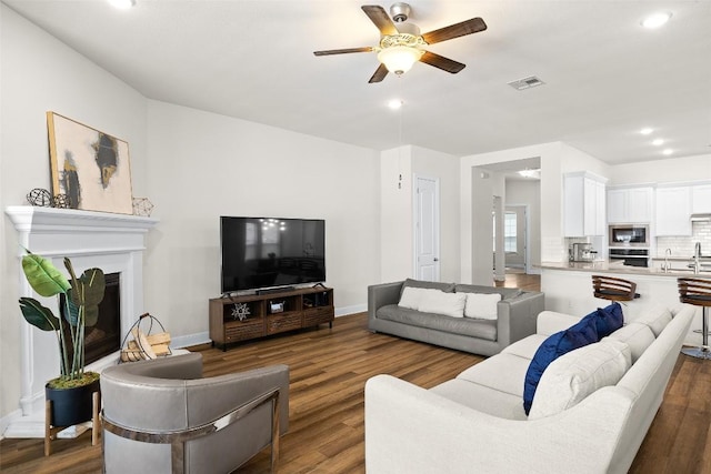 124 Adina Dr, Dripping Springs, TX 78620 - living area with a ceiling fan, dark wood finished floors, baseboards, and recessed lighting