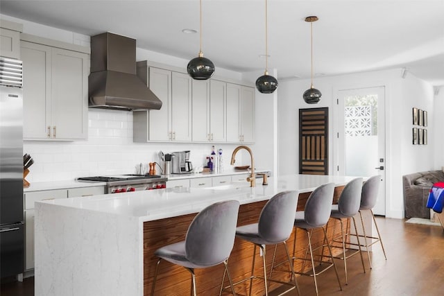 4420 Mount Vernon Dr Unit A, Austin, TX 78745 - kitchen featuring wall chimney range hood, stove, stainless steel built in refrigerator, tasteful backsplash, and light countertops