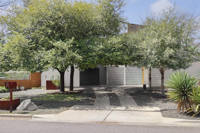 4420 Mount Vernon Dr Unit A, Austin, TX 78745 - view of property hidden behind natural elements featuring concrete driveway