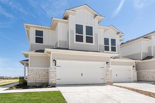 2035 Cora Ivy Loop, Round Rock, TX 78665 - view of front of home featuring stone siding, board and batten siding, an attached garage, and driveway