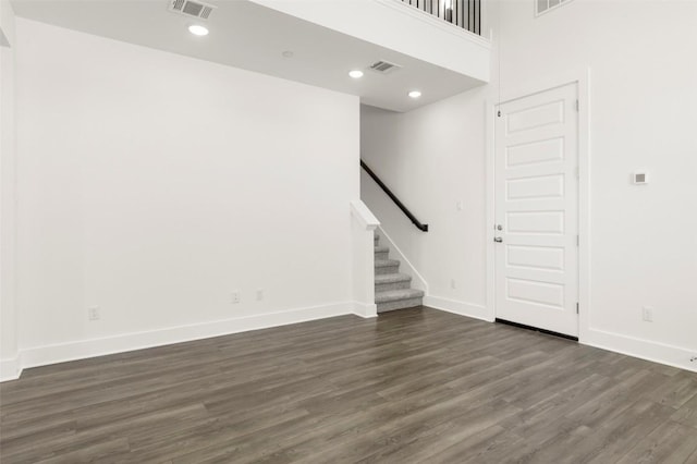2035 Cora Ivy Loop, Round Rock, TX 78665 - unfurnished living room featuring dark wood-style floors, baseboards, stairway, and recessed lighting