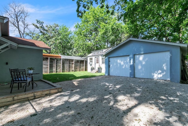 1308 Kinney Ave, Austin, TX 78704 - view of yard featuring an outdoor structure and gravel driveway