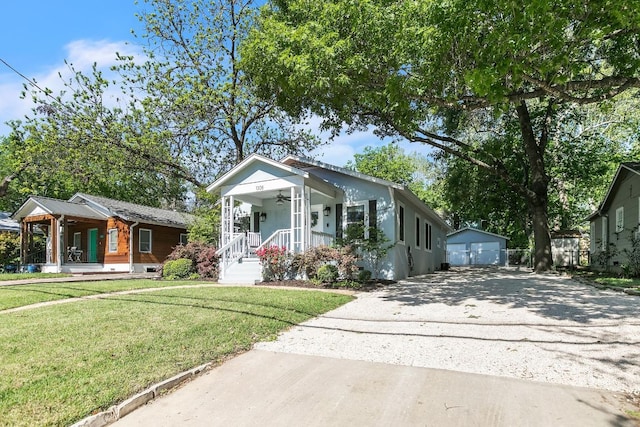 1308 Kinney Ave, Austin, TX 78704 - view of front facade with a porch, a garage, a front yard, and a ceiling fan