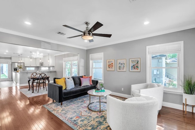 1308 Kinney Ave, Austin, TX 78704 - living area featuring wood-type flooring, a chandelier, a ceiling fan, recessed lighting, and baseboards