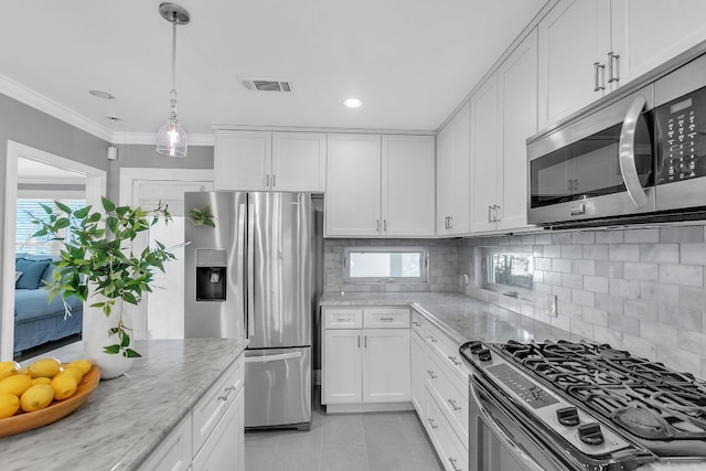 1308 Kinney Ave, Austin, TX 78704 - kitchen with stainless steel appliances, light tile patterned floors, decorative backsplash, light stone countertops, and ornamental molding