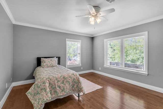 1308 Kinney Ave, Austin, TX 78704 - bedroom with dark wood-type flooring, baseboards, ornamental molding, and ceiling fan