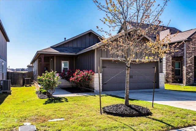 view of front of property featuring board and batten siding, an attached garage, central AC unit, and driveway