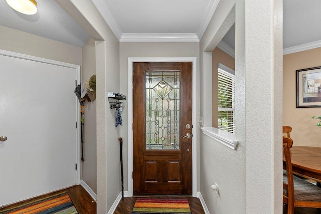 308 Hobby St, Georgetown, TX 78633 - foyer with dark wood-type flooring, ornamental molding, and baseboards