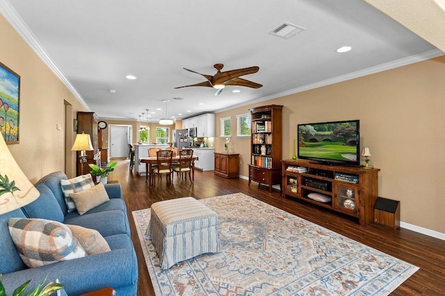 308 Hobby St, Georgetown, TX 78633 - living room featuring ornamental molding, a ceiling fan, baseboards, recessed lighting, and dark wood-type flooring