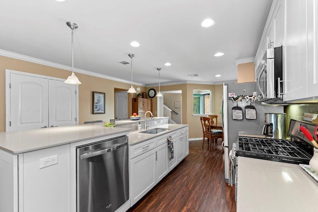 308 Hobby St, Georgetown, TX 78633 - kitchen with appliances with stainless steel finishes, a sink, white cabinets, crown molding, and a kitchen island with sink