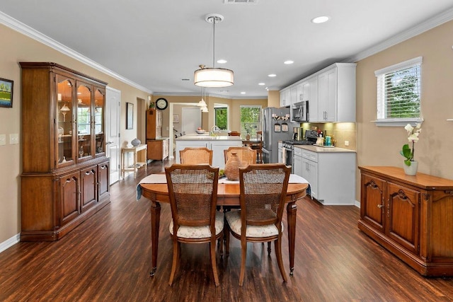 308 Hobby St, Georgetown, TX 78633 - dining room featuring dark wood-style floors, plenty of natural light, crown molding, recessed lighting, and baseboards