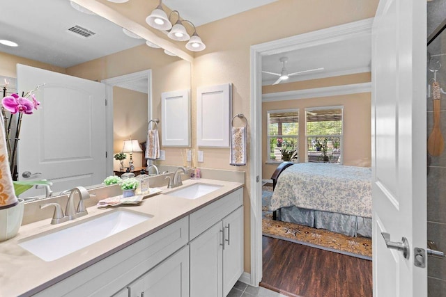 308 Hobby St, Georgetown, TX 78633 - ensuite bathroom featuring double vanity, ceiling fan, and wood finished floors