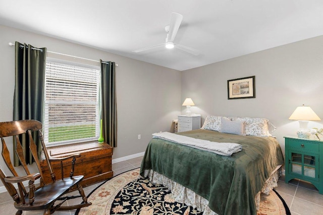 308 Hobby St, Georgetown, TX 78633 - bedroom featuring light tile patterned floors, a ceiling fan, and baseboards