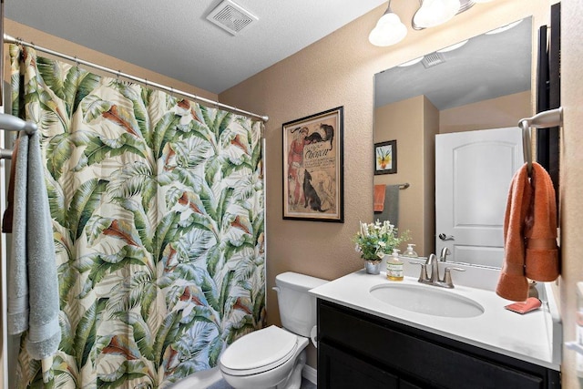 308 Hobby St, Georgetown, TX 78633 - bathroom featuring toilet, vanity, a textured wall, and a shower with curtain