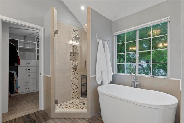 6301 Harrogate Dr, Austin, TX 78759 - full bath featuring a stall shower, a freestanding tub, a walk in closet, healthy amount of natural light, and vaulted ceiling