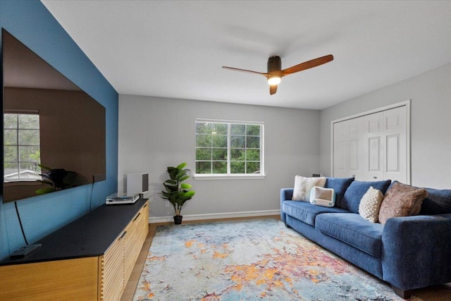 6301 Harrogate Dr, Austin, TX 78759 - living area featuring a ceiling fan, baseboards, and wood finished floors
