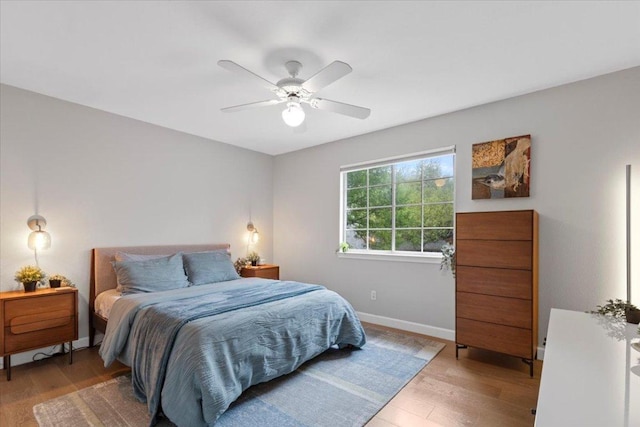 6301 Harrogate Dr, Austin, TX 78759 - bedroom with light wood-style flooring, baseboards, and a ceiling fan