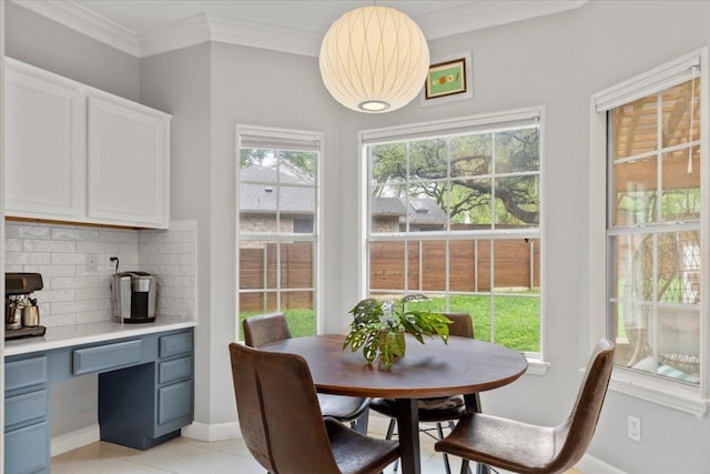 6301 Harrogate Dr, Austin, TX 78759 - dining area with ornamental molding, baseboards, and light tile patterned flooring