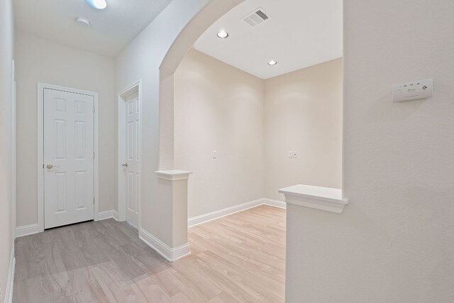 738 Nelson Ranch Rd, Cedar Park, TX 78613 - hall featuring arched walkways, light wood-type flooring, baseboards, and recessed lighting