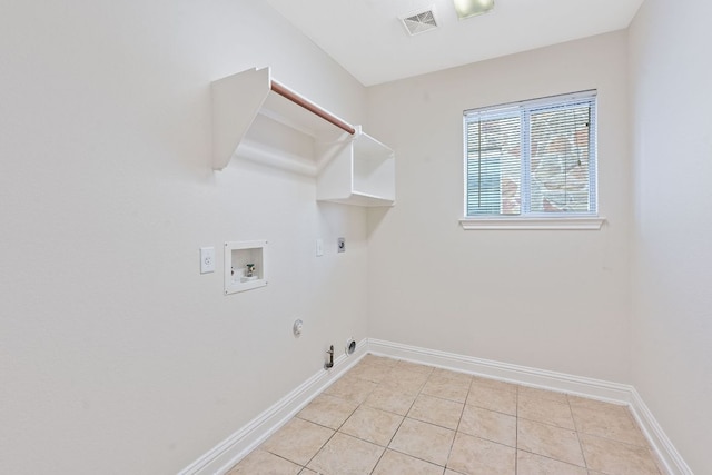 738 Nelson Ranch Rd, Cedar Park, TX 78613 - washroom with gas dryer hookup, washer hookup, electric dryer hookup, light tile patterned floors, and baseboards