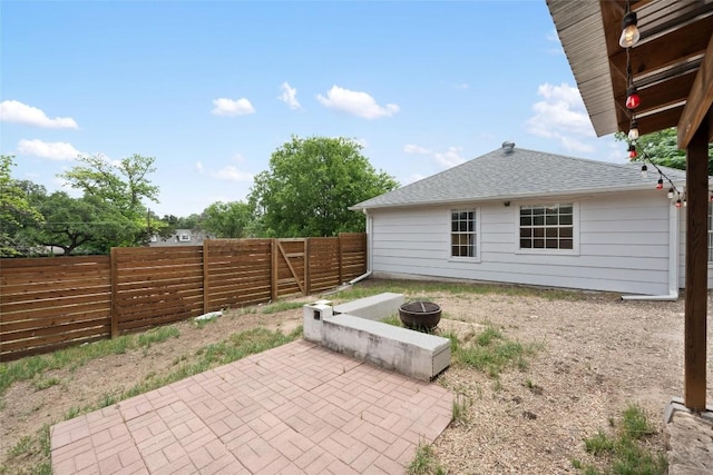 11708 Hornsby Dr, Austin, TX 78753 - fenced backyard featuring a fire pit and a patio