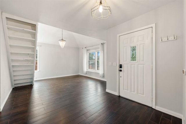 11708 Hornsby Dr, Austin, TX 78753 - foyer with a chandelier, dark wood finished floors, and baseboards