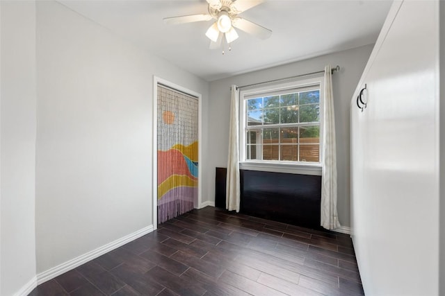 11708 Hornsby Dr, Austin, TX 78753 - unfurnished room featuring baseboards, dark wood-style floors, and ceiling fan