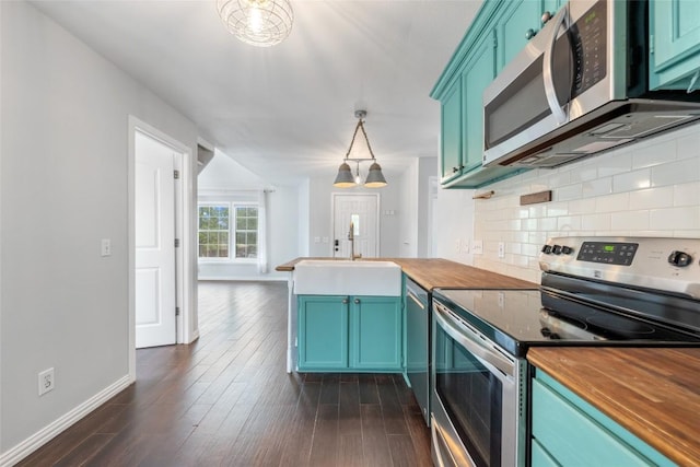 11708 Hornsby Dr, Austin, TX 78753 - kitchen featuring appliances with stainless steel finishes, butcher block countertops, a sink, baseboards, and decorative backsplash