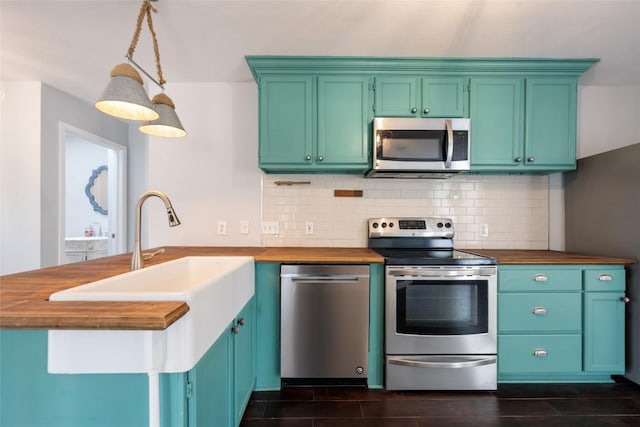 11708 Hornsby Dr, Austin, TX 78753 - kitchen with stainless steel appliances, wood counters, a sink, and tasteful backsplash
