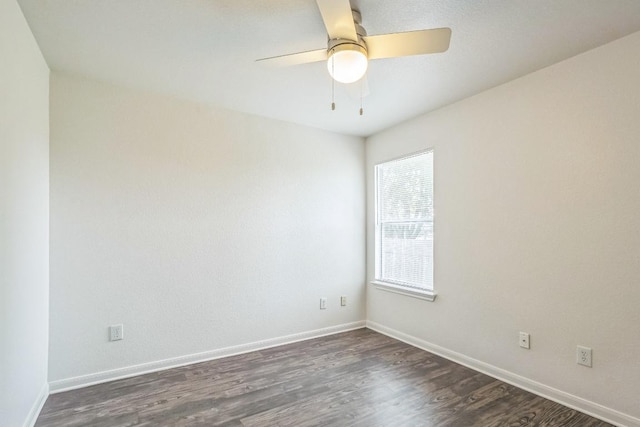 211 Warner Bnd, Hutto, TX 78634 - spare room with dark wood finished floors, baseboards, and ceiling fan