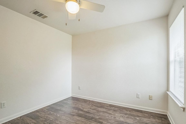 211 Warner Bnd, Hutto, TX 78634 - unfurnished room featuring ceiling fan, dark wood-style floors, and baseboards