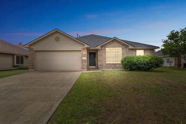 211 Warner Bnd, Hutto, TX 78634 - single story home featuring an attached garage, concrete driveway, a yard, and brick siding