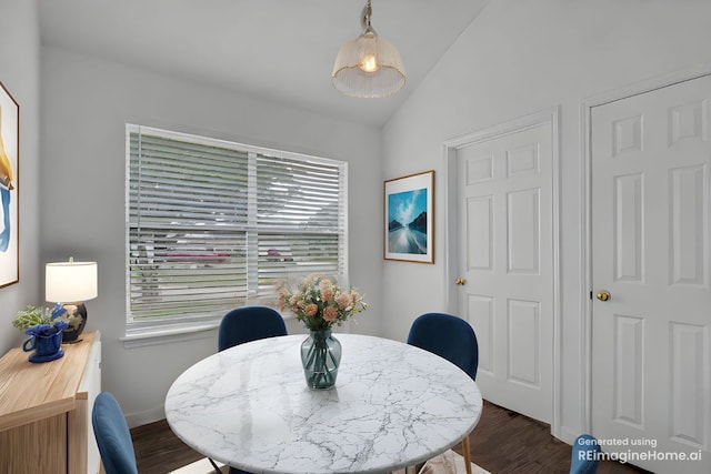 211 Warner Bnd, Hutto, TX 78634 - dining room with vaulted ceiling, dark wood-style floors, and baseboards