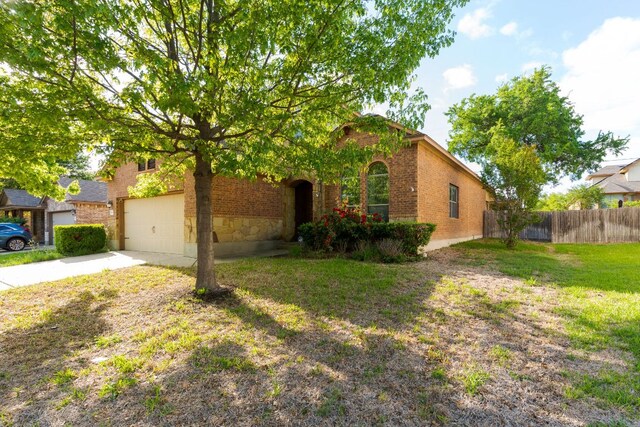 5405 English Oak Dr, Killeen, TX 76542 - view of front facade featuring a garage, fence, a front lawn, brick siding, and driveway