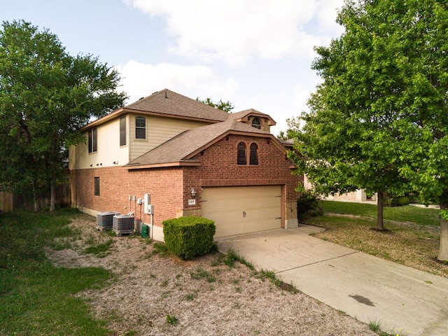 5405 English Oak Dr, Killeen, TX 76542 - view of side of home with brick siding, an attached garage, a shingled roof, and driveway